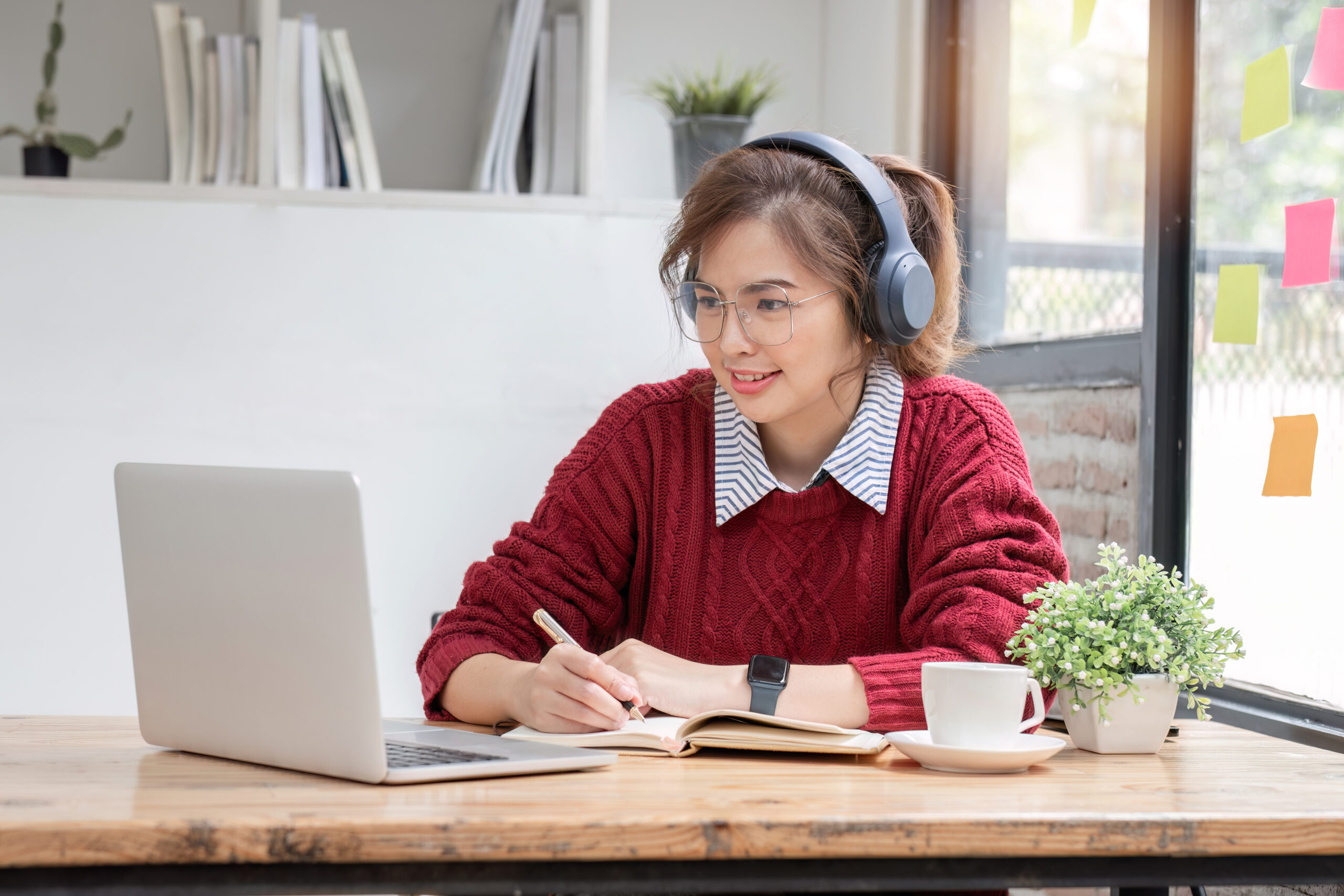 Asian female student study online in class, study online, wearing headphones, watching video call, zooming, happy asian female learning language online with computer laptop.